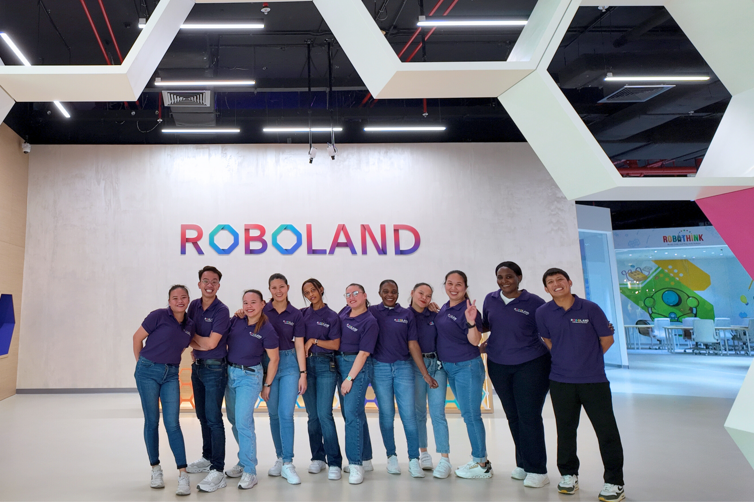 Team at Roboland children's museum in Dubai, working together with enthusiasm.